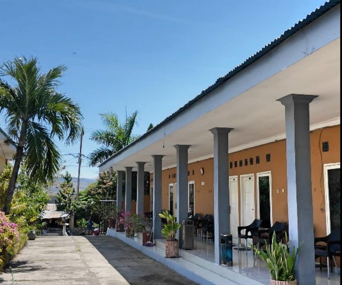 : A professionally managed 11-room workforce housing facility in central Waingapu, showing clean, air-conditioned units and a central café hub for professional staff.