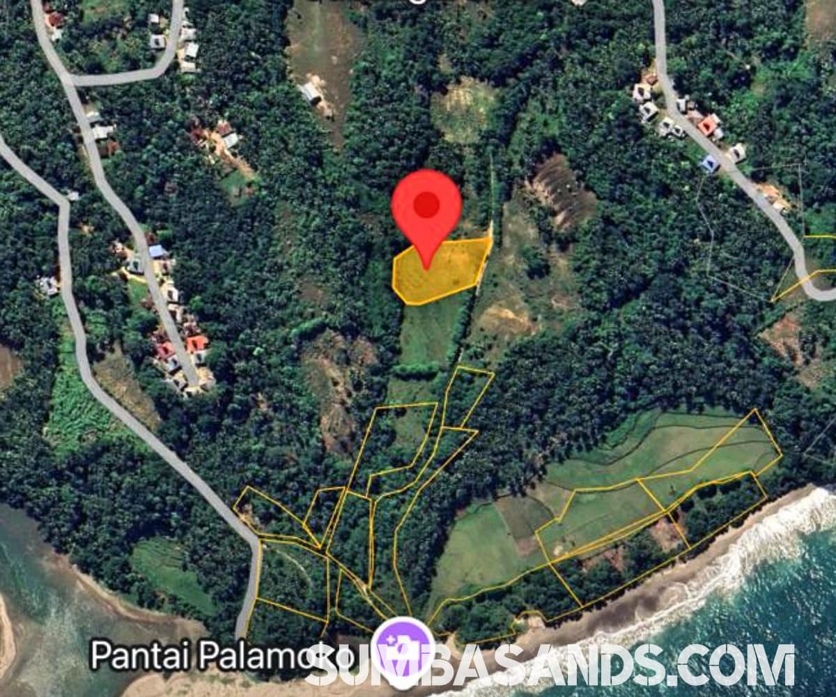 A dramatic aerial panorama of the Palamoko Nihiwatu Neighbor Plot. The image showcases the elevated hill plot with a direct line of sight to the iconic Nihiwatu shoreline and Palamoko Beach.