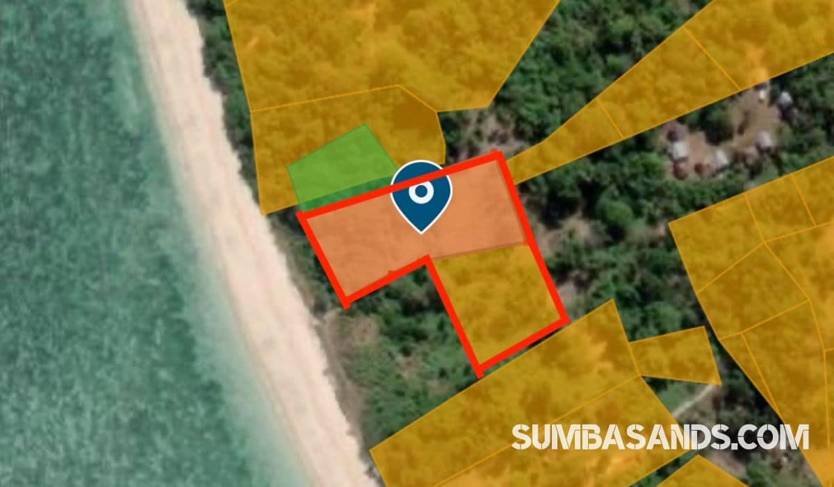 A panoramic aerial view of the Wainyapu Beachfront Surf Estate. The image captures flat, pristine land meeting the turquoise waters of the Indian Ocean, with a wide white-sand beach and the traditional high-roofed houses of Wainyapu village in the background.