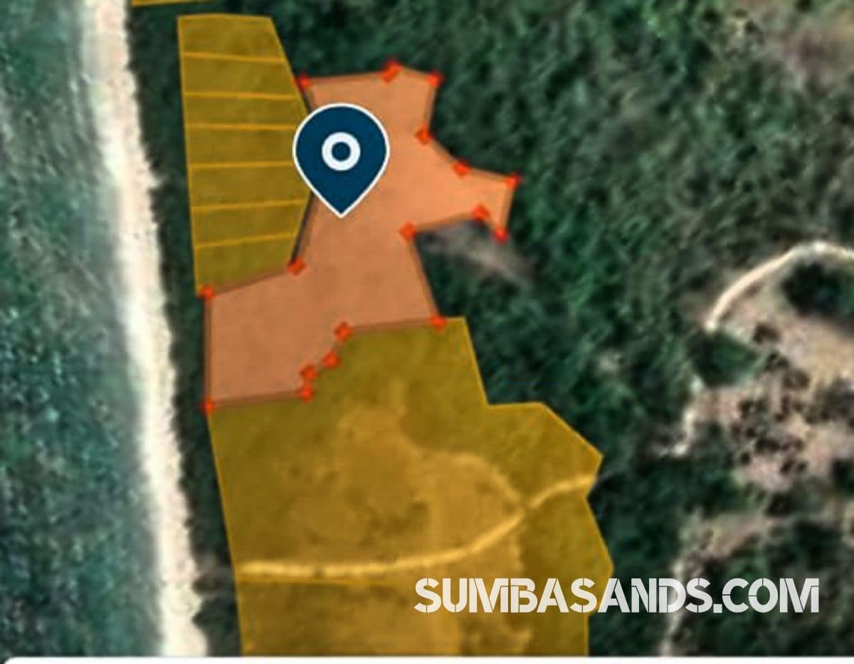 A dramatic aerial view of the Kodi Premier Beachfront Estate. The image captures 1 hectare of lush green land meeting a 20-meter sandy shoreline, featuring a natural cliff buffer and direct access to the main regional road