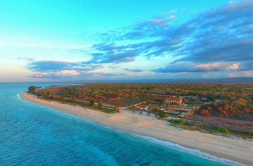 White sand and clear blue water of Mananga Aba Beach in front of Mario Hotel Sumba.