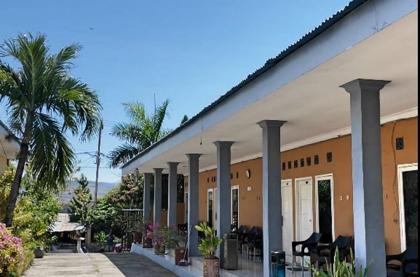 : A professionally managed 11-room workforce housing facility in central Waingapu, showing clean, air-conditioned units and a central café hub for professional staff.